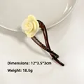 Deep brown acetate hair claw clip with beige rose flower accent for elegant styling - Yellow