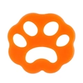 Bright orange paw-shaped silicone pet hair remover tool with five hollow grip holes - Flower Orange