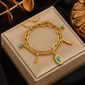 Bracelet double rang en acier inoxydable doré avec turquoise ovale et pendentifs éclair - Doré