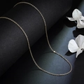Elegant gold titanium steel O-chain necklace displayed with delicate white petals - 40# Silver O-shaped Chain (pure Necklace)