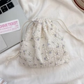 Detail of floral drawstring pouch with puckered texture for jewelry and gift storage - Beige Purple Flower