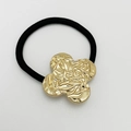 Black hair tie with a gold-finish four-leaf clover alloy charm for elegant ponytails - Shiny Gold - Textured Clover