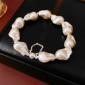 Macro shot of irregular baroque pearls on black leather with silver magnetic clasp - Irregular Pearl Style / White (Silver Magnetic Clasp)