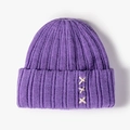 Purple ribbed knit beanie with white decorative X-stitch cross patterns on the cuff - One Size / Purple