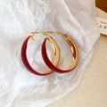Close-up of oversized red and gold hoop earrings on textured white paper background - Gold Splicing Red (Silver Pin)