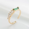 Detailed side view of an 18K gold plated ring with green and white baguette zircons - Rectangular Green White Zirconia (12105)