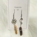Asymmetric celestial earrings with sun and moon motifs and natural stones on white fur - Yellow Jasper