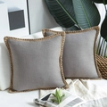 Detail of grey linen pillow covers with jute woven lace on a modern white sofa - Light Gray