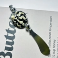 Single butter knife with a black and white patterned handle and polished silver blade - Black King Kong Shell Butter Knife