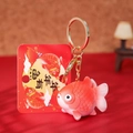 Lucky koi fish keychain in orange-red gradient with golden ring and Year of Fish card - Blessing Goldfish Keychain / Solid Red
