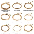 Bracelets gourmette en acier titane doré déclinés en neuf modèles dont maille Figaro - Collier Chaîne de Corde / Or