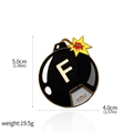 Funny black bomb enamel pin with 'F YOU' text and golden metal finish on white background - Funny Bomb Badge (X00417)