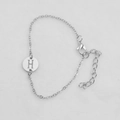 Silver chain bracelet with round cutout pendant featuring the letter H and lobster clasp - Silver H