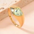 Macro shot of gold stainless steel ring featuring a heart-shaped green gemstone inlay - US 8 / Light Green