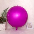 Glossy magenta 4D aluminum foil balloon for party decoration on a soft white rug - 4D Sphere Rose Red / 22 Inch