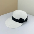 Women's woven straw sun hat in cream white featuring a wide decorative black ribbon bow - Adjustable M (56-58cm) / White