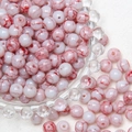 Macro shot of 8mm white glass beads with red cracked pattern for DIY jewelry making - Red White Gradient
