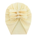 Detail view of light yellow soft cotton baby turban hat with a triple-knot bow design - Beige