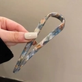U-shaped acetate hair pin with blue brown marble texture held in hand - Blue Brown Marble / Azure Crescent U-Shaped Hairpin