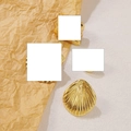 Minimalist golden stainless steel seashell earring on rustic paper background - Gold Seashell Fan Earrings