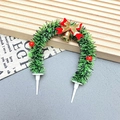 Detailed Christmas wreath cake topper with red bow, gold bell, and berries on dual white pins - Wreath-1004