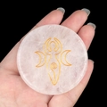 Pink Rose Quartz stone with engraved golden Triple Moon Goddess symbol held in hand - White Crystal Goddess