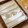 Elegant pair of white round pearl stud earrings displayed in a premium walnut jewelry box - 43# Bun Pearl Earrings (10mm)