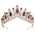 Close-up of luxury bridal crown with deep red crystals and rhinestones on gold base - KC Gold White & Purple Rhinestone