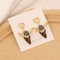 Macro shot of vintage bull head earrings with golden heart studs and grey gemstone detail - Grey Purple Gemstone Gold Bull Style (4#)
