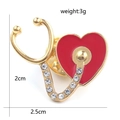 Golden stethoscope heart brooch with red enamel and rhinestones, 2.5cm by 2cm size - Full Diamond Stethoscope Gold