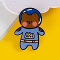 Cute brown astronaut bear enamel pin with light blue spacesuit and red heart accent - 11 Aerospace Bear