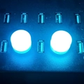 Dual circular blue LED USB night lamps plugged into a multi-port black hub - Ice Blue Light