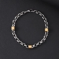 Detail of silver titanium steel curb chain with gold textured beads on black leather - 6mm Round Rolo Chain With Gold Beads Bracelet / 21cm