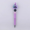 Detail of purple beaded pen featuring a silicone pumpkin with Stay Spooky text - Purple Pumpkin