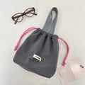 Grey wool storage bag with white polka dots and pink drawstring handle - Gray