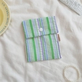 Portable cotton storage bag featuring green and blue vertical stripes with a snap button - Bubble Green Stripe