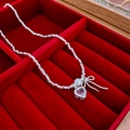 Detail of pink heart zircon and pearl necklace displayed on red velvet gift tray - Heart Bowknot Necklace