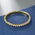 Macro shot of gold tennis bracelet featuring rows of clear sparkling cubic zirconia stones - 1 Row / Gold