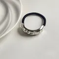 Black elastic hair tie with silver irregular hammered metal oval decorative element - Silver Single Tube Wrinkled