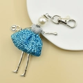 Detail of handmade keychain girl with blue sequin dress, pearl head, and silver heart charm - 13-Blue Sequin Dress Doll