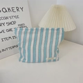 Detail of blue striped canvas bag with Sorakka woven label and fine woven fabric texture - Makeup Bag