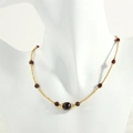 Detail of beaded necklace with gold spheres and faceted deep red garnet gemstones - Garnet (NE1991)
