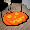 Orange Halloween pumpkin shaped plush floor mat with smiling face on wooden floor - Large Pumpkin Shape