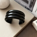 Macro shot of the black three-layered geometric resin cuff bracelet with polished finish - 3-Layer Glossy Black / Black