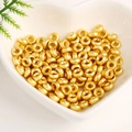 18K gold-plated spacer beads for jewelry making displayed in a heart-shaped ceramic bowl - 4mm Hole 1.5mm / Ancient Gold