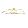Detail of adjustable gold box chain bracelet featuring a clear hexagonal stone charm - Copper+Citrine