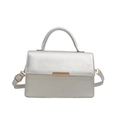 Modern silver faux leather handbag with gold buckle and crossbody strap for women - Silver