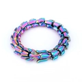 Macro detail of the interlocking rainbow dragon scale links on this stainless steel bracelet - 19cm / Rainbow