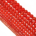 Makroaufnahme von roten Katzenaugen-Edelsteinperlen für DIY-Schmuck in verschiedenen Größen - Durchmesser 6mm (ca. 60 Stk.) / Rot