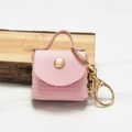 Mini portamonete in ecopelle rosa con cuciture a onde e portachiavi dorato - Rosa